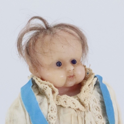 *A sweet all original poured wax baby doll, English circa 1860, - 2