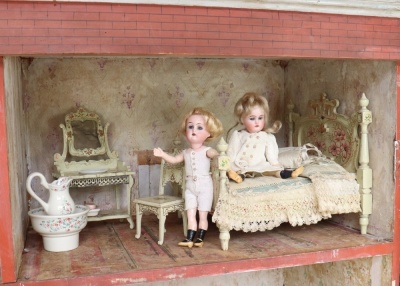 A large early painted wooden red brick Dolls House, English circa 1850, - 2