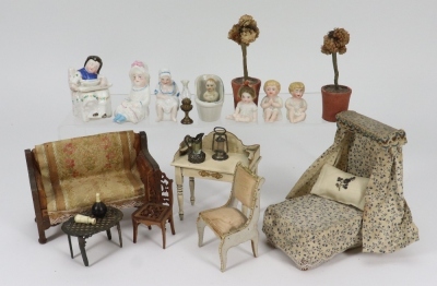 A collection of miniature figurines and dolls house furniture, circa 1910,