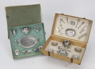 Two original boxed miniature metal dolls dining sets, German circa 1915,