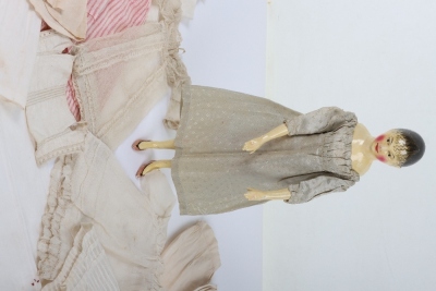 A rare and exquisite early painted carved wooden doll with her original extensive wardrobe, including seven gowns, nightdress and initialled undergarments, German circa 1810, - 3
