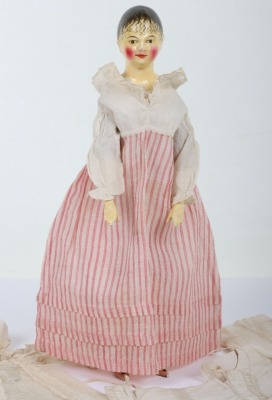 A rare and exquisite early painted carved wooden doll with her original extensive wardrobe, including seven gowns, nightdress and initialled undergarments, German circa 1810, - 4
