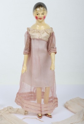 A rare and exquisite early painted carved wooden doll with her original extensive wardrobe, including seven gowns, nightdress and initialled undergarments, German circa 1810, - 6