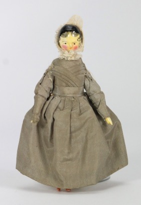 A good painted wooden Grodnertal doll in original Quaker style clothes, German circa 1820,