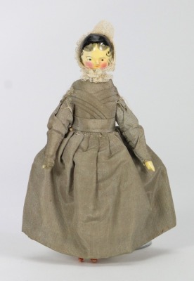A good painted wooden Grodnertal doll in original Quaker style clothes, German circa 1820,