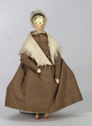 A good painted wooden Grodnertal doll in original Quaker style clothes, German circa 1820,