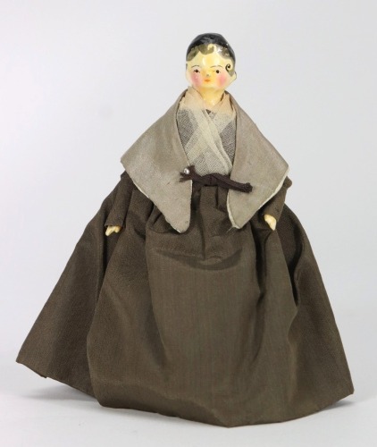 A good painted wooden Grodnertal doll in original Quaker style clothes, German circa 1820,