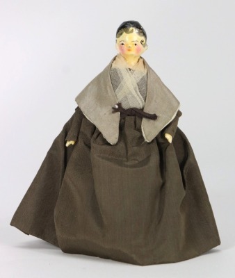 A good painted wooden Grodnertal doll in original Quaker style clothes, German circa 1820,