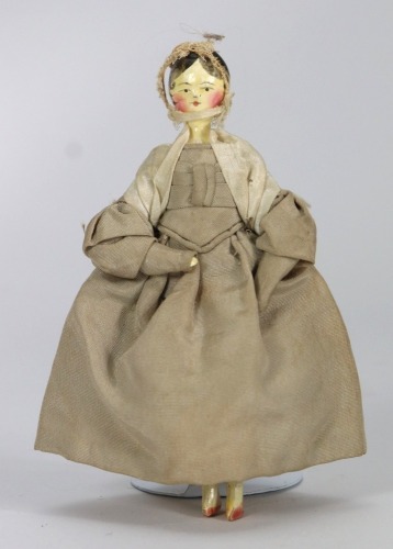 A good painted wooden Grodnertal doll in original Quaker style clothes, German circa 1820,
