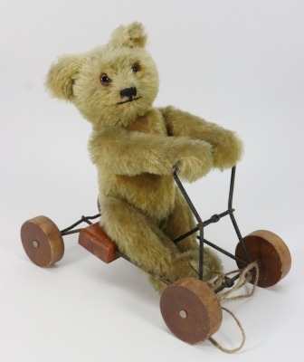 A rare British United Toy Manufacturing Co Ltd Omega bear coaster on wheels, circa 1915,