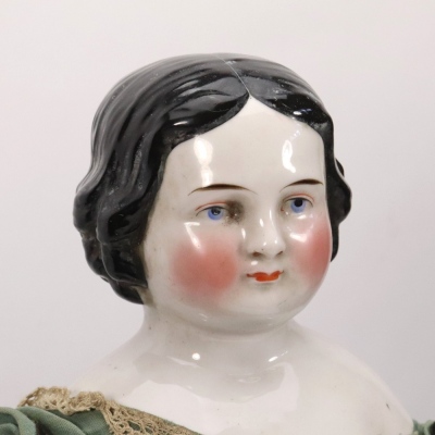 A good and large early glazed china shoulder head doll in original clothes, English circa 1860,