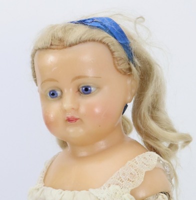 A wax over composition shoulder head doll, German circa 1860, - 2