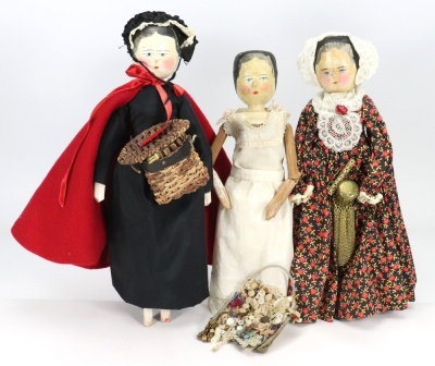 Three painted wooden Peg-dolls, German late 19th century,