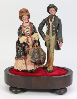 A pair of Edwardian composition shoulder head dolls in original crepe outfits,