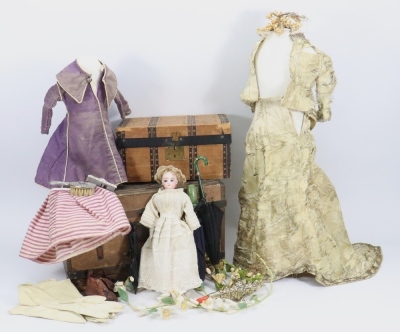 Dolls trunk with fashion doll, dresses, silver rattle and more,