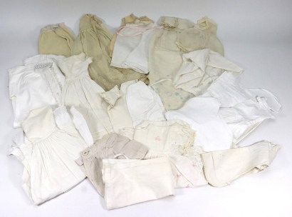 A selection of various dolls clothes,