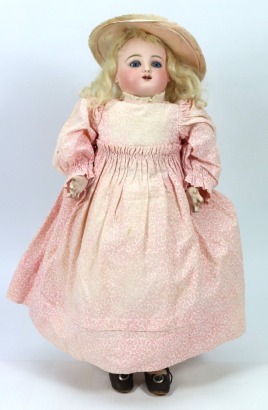 *A good Bebe Gigoteur, &lsquo;Kicking Steiner&rsquo; bisque head mechanical doll, French circa 1880,