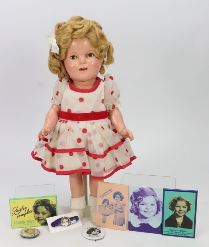 *A composition Shirley Temple doll in original outfit, American 1930s,