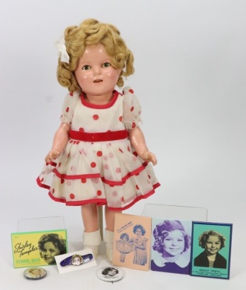 *A composition Shirley Temple doll in original outfit, American 1930s,