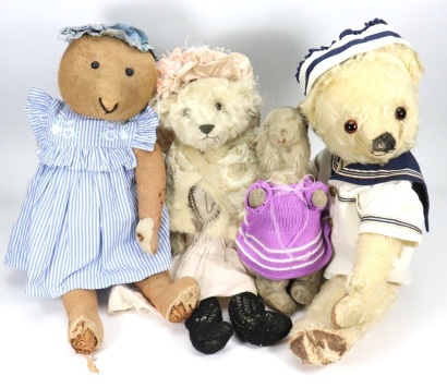 Three Teddy bears and a toy Rabbit,