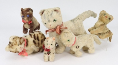 A collection of six toy cats,