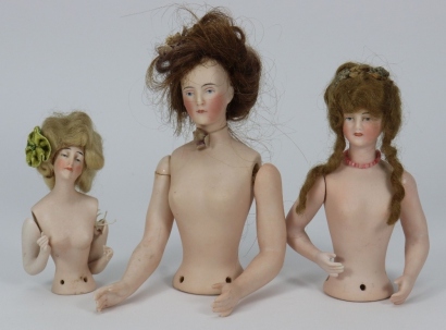 Three bisque pin-cushion half-dolls,