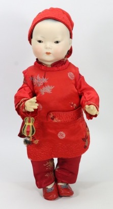 *A large all original bisque head Asian baby, German circa 1910,