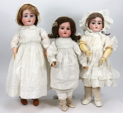 Three bisque head girl dolls including a DEP 1900, circa 1915,