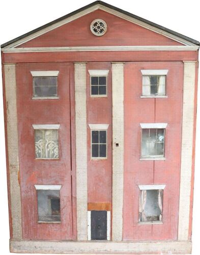 A large early painted wooden red brick Dolls House, English circa 1850,