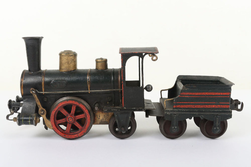 Early Marklin cast iron clockwork 0-2-2 locomotive and tender