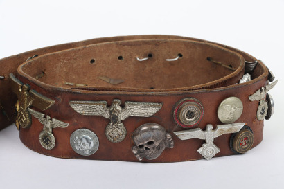 British Victory or Hate Belt Fitted with Germann WW2 Cap Insignias and Other Items of Insignia