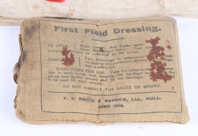A WW1 First Field Dressing and RAMC Red Cross Armband. - 2