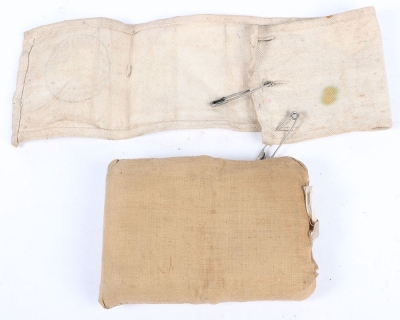 A WW1 First Field Dressing and RAMC Red Cross Armband. - 4
