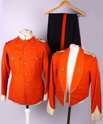 The Devonshire Regiment, A Lieutenant&acirc;&euro;&trade;s Two Pocket Frock Tunic, in scarlet cloth with white facings; together with a scarlet mess jacket, this with white cloth cuffs and shoulder straps. The turn back lapels in red silk and appropriate silver/gilt/ename