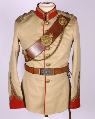 Full Dress Uniform of Lieutenant Colonel A T Rowlandson 124th Baluchistan Infantry & Cross Belt and Waist Belt of 126th Baluchistan Infantry, the full dress tunic in French Grey / beige cloth with red facings to the collar and cuffs. Central red stripe to