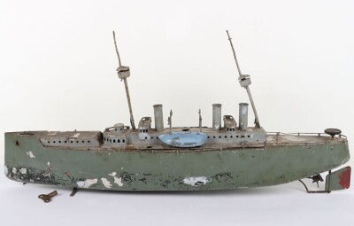 A large clockwork tinplate four funnel boat, probably German circa 1910