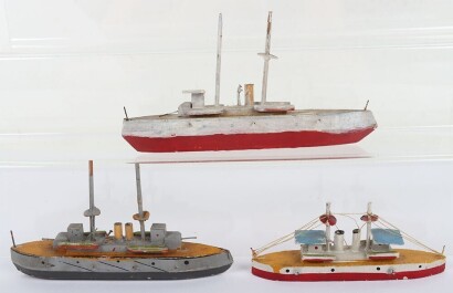 Three wooden model boats
