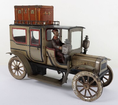 Carette tinplate clockwork Limousine, German circa 1909, finished in grey and black with cream lining and red window frames, roof with roof rack and running boards, hinged doors to rear, with glass windows, tinplate driver on padded style bench seat, two - 5
