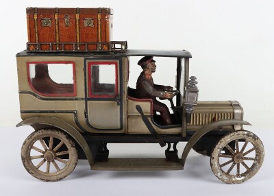Carette tinplate clockwork Limousine, German circa 1909, finished in grey and black with cream lining and red window frames, roof with roof rack and running boards, hinged doors to rear, with glass windows, tinplate driver on padded style bench seat, two - 6