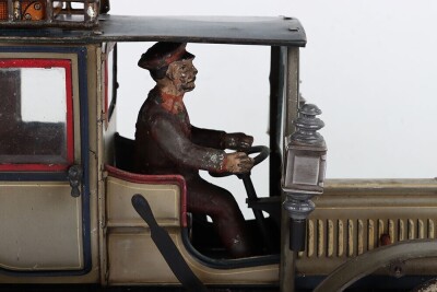 Carette tinplate clockwork Limousine, German circa 1909, finished in grey and black with cream lining and red window frames, roof with roof rack and running boards, hinged doors to rear, with glass windows, tinplate driver on padded style bench seat, two - 7