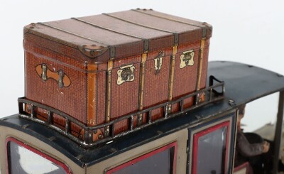 Carette tinplate clockwork Limousine, German circa 1909, finished in grey and black with cream lining and red window frames, roof with roof rack and running boards, hinged doors to rear, with glass windows, tinplate driver on padded style bench seat, two - 9