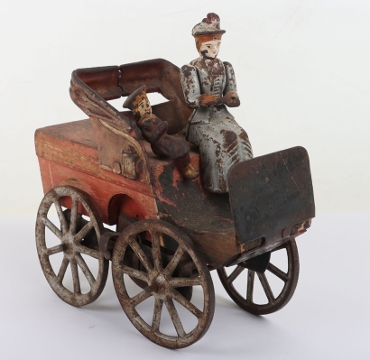 Wooden and cast iron flywheel driven early motorcar, American circa 1903