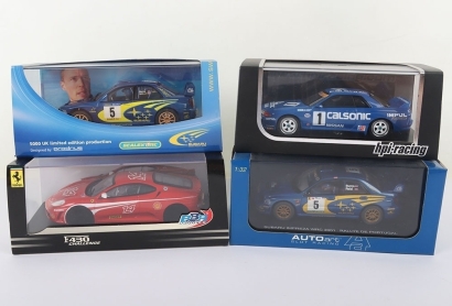 Four Boxed Slot Car Models