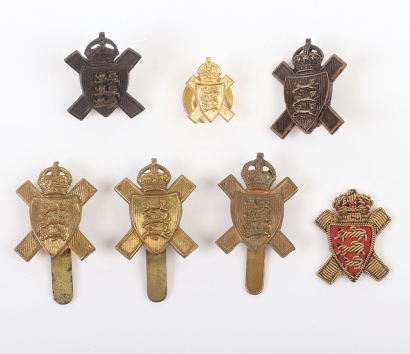 Grouping of Royal Jersey Light Infantry Cap and Collar Badges