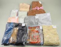 Assortment of material suitable for making dolls clothes,