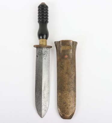 Mid-20th Century Divers Knife, broad double edge shallow diamond section blade 19.5ms, brass mounted composition grip with ribbed top, in its solid brass sheath. Good condition.