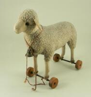 A Steiff wool plush Lamb on wheels, 1920s,