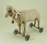 A Steiff wool plush Lamb on wheels, circa 1920,