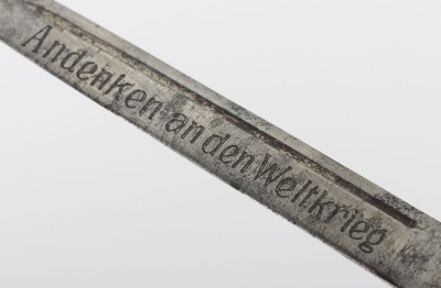 Miniature German K98 Bayonet, with wooden grips, blade engraved 'Andenken an den Weltkrieg'. No scabbard. Accompanied by a smaller bronze miniature of a German bayonet with oakleaves relief to the hilt and body. Also without scabbard. (2 items) - 5