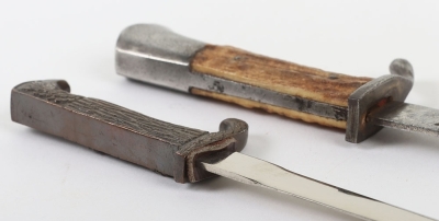 Miniature German K98 Bayonet, with wooden grips, blade engraved 'Andenken an den Weltkrieg'. No scabbard. Accompanied by a smaller bronze miniature of a German bayonet with oakleaves relief to the hilt and body. Also without scabbard. (2 items) - 6